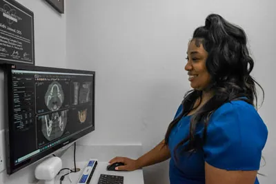 Starlite Dental hygienist reviewing a patient's dental x-rays