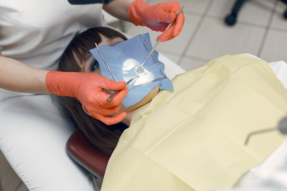 photo showing a young girl during a dental procedure