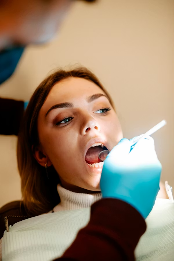 an image showing a woman during a dental check-up