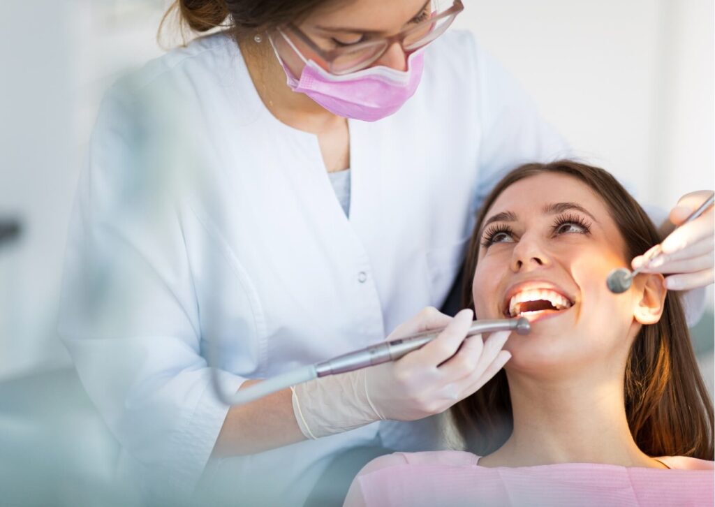 Patient discussing E-max vs. Empress veneers with a cosmetic dentist during a smile evaluation appointment